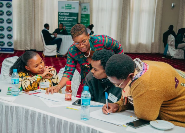Participants working together at a workshop table