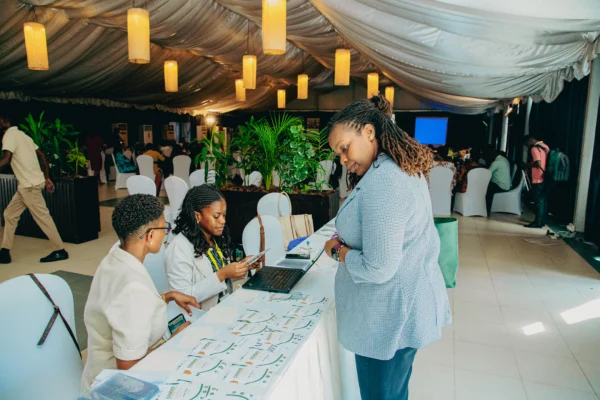 Delegates at a conference registration desk