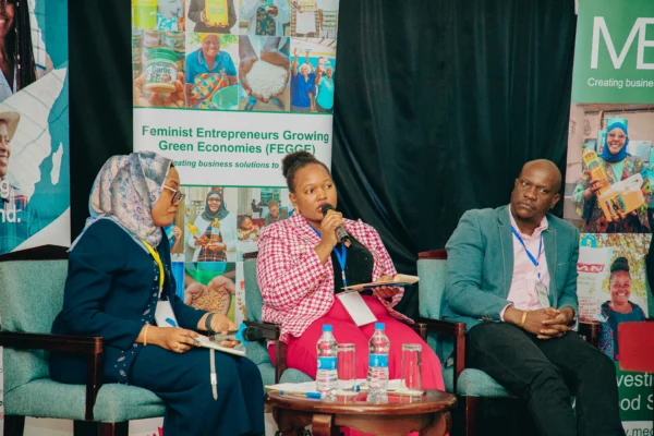 Panel session in front of programme banners