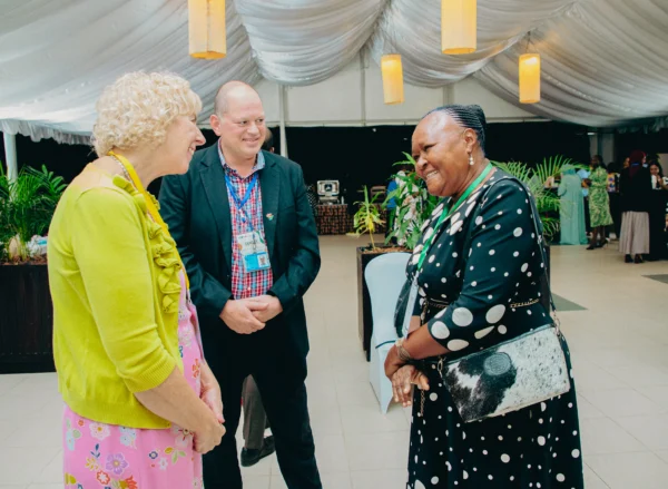 Delegates greeting each other at a conference