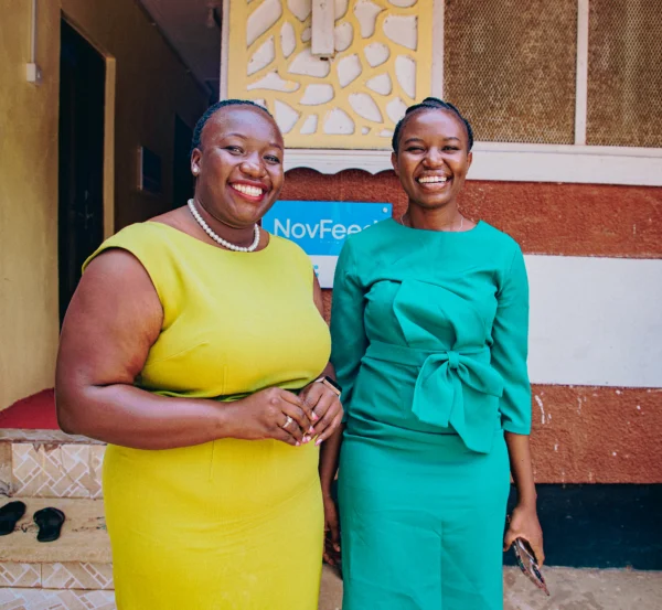 Two agribusiness colleagues outside their premises